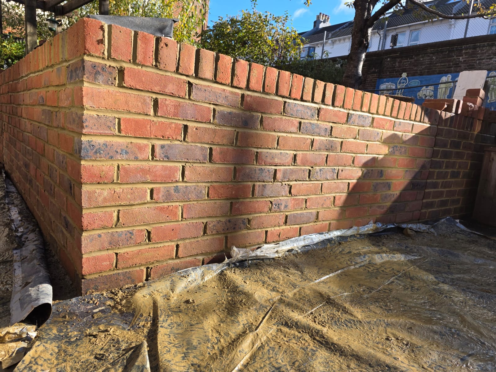 New red-brick garden retaining wall