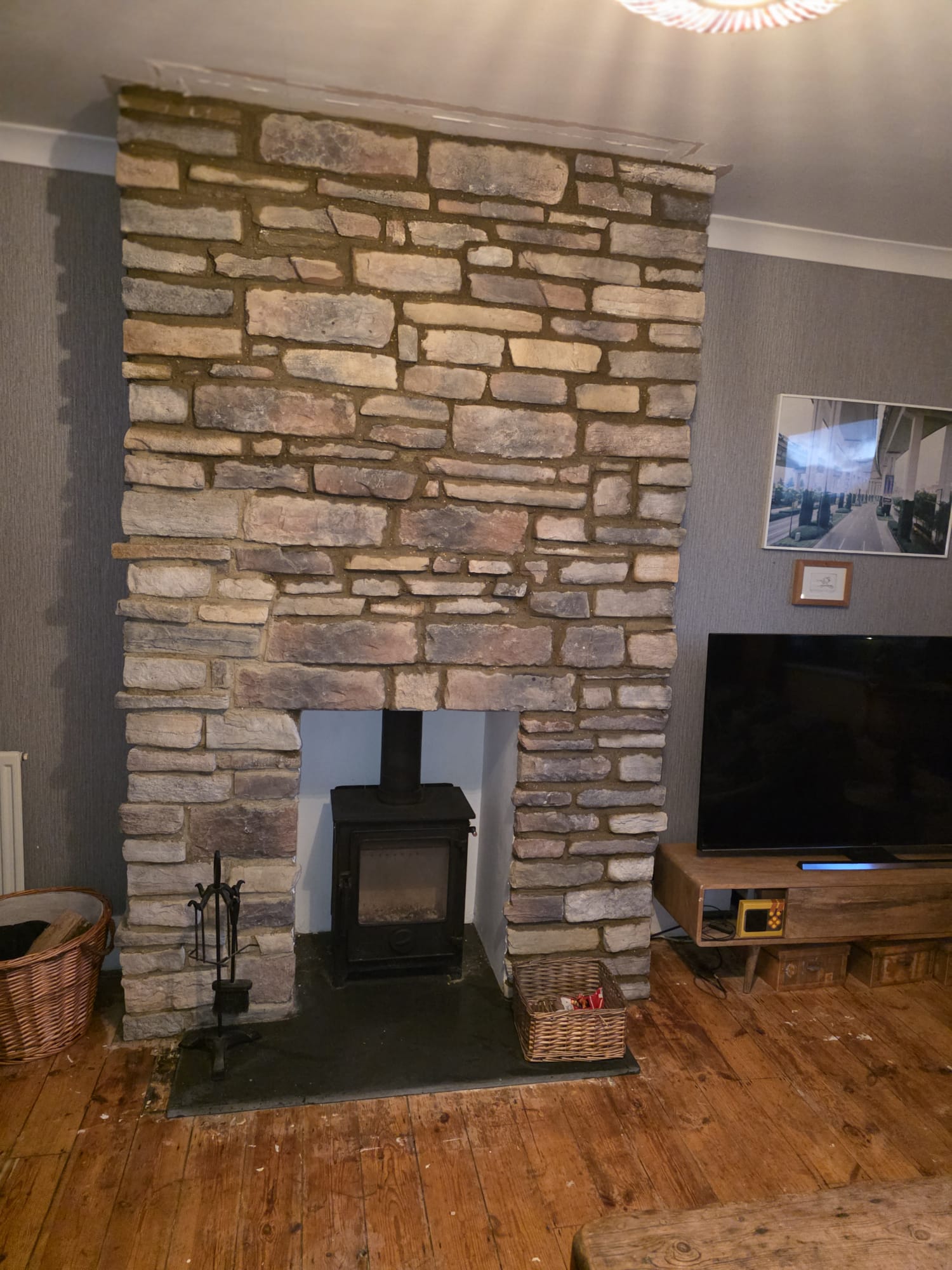 Natural stone chimney breast & log burner