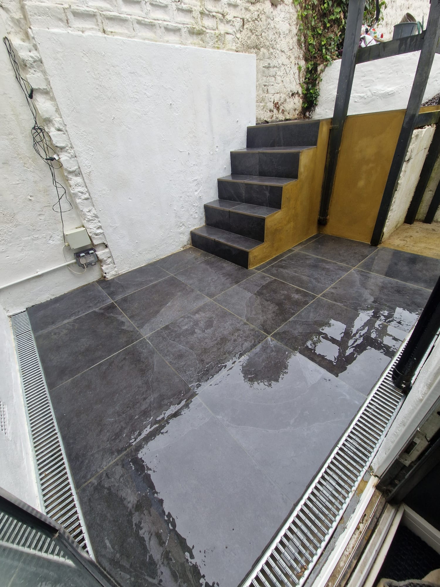 Slate patio with steps & drainage